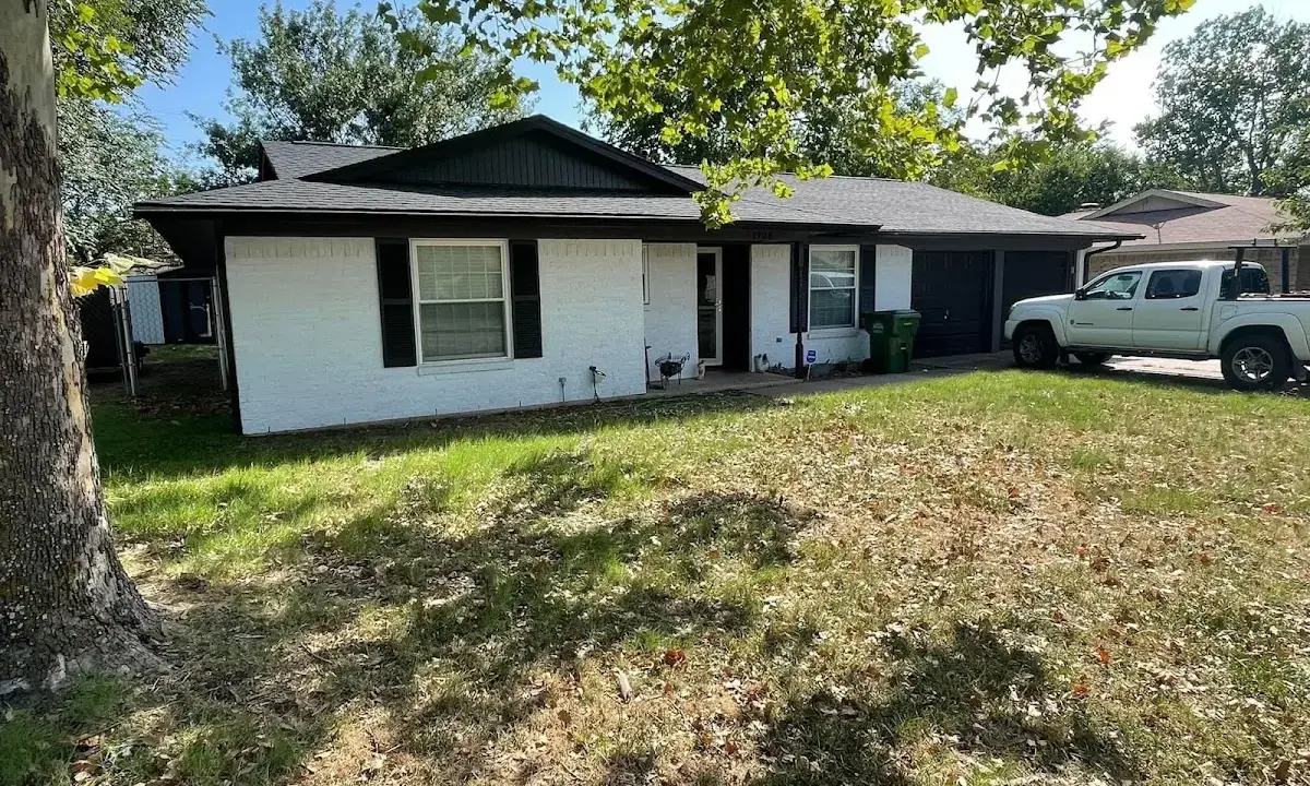 Professional roofing crew working on a residential roof in Crystal Lake